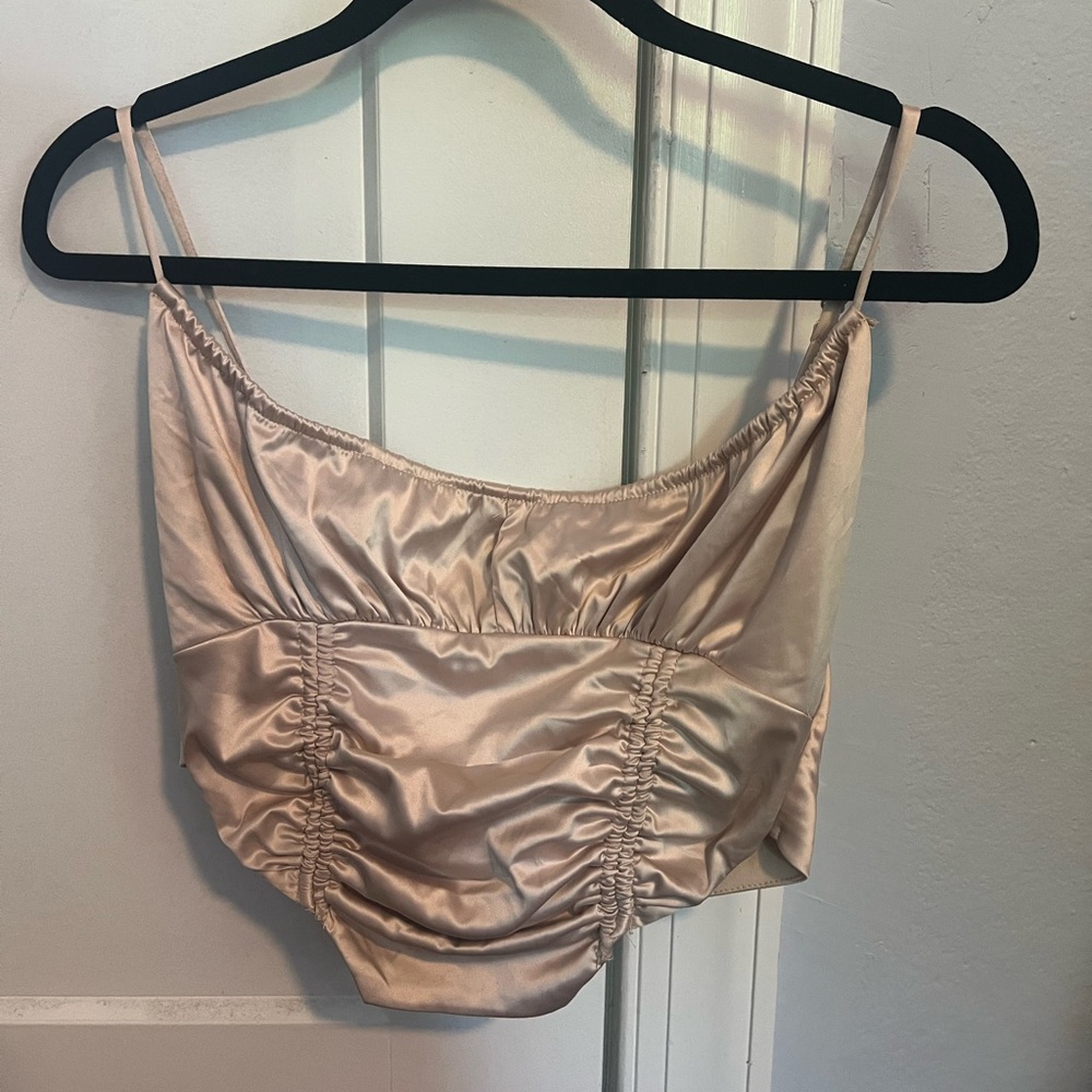 Champagne colored crop top. Super cute dressed up or down!